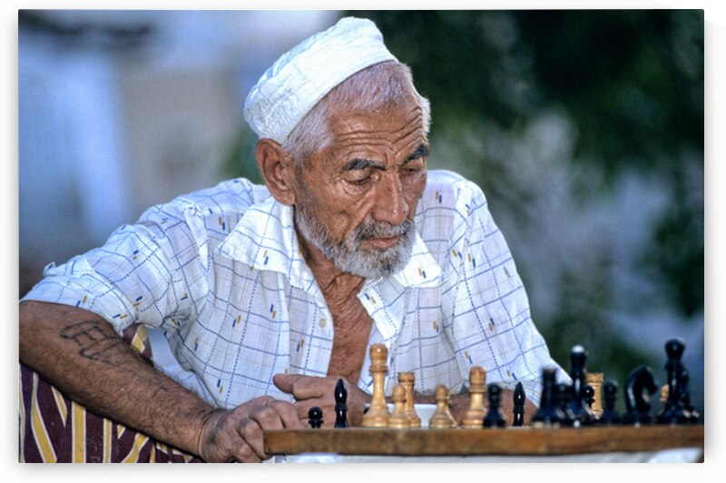 Elderly man plays chess in Bukhara Uzbekistan by Marco Brivio