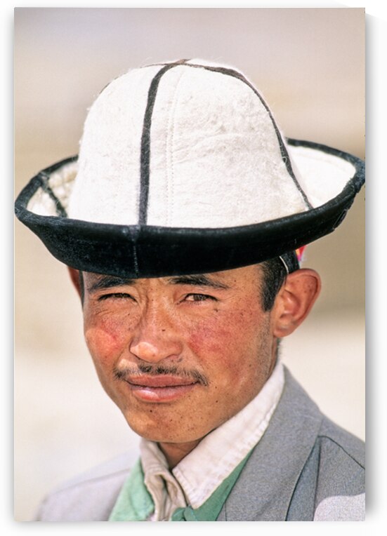 Young man in traditional hat from Uzbekistan by Marco Brivio