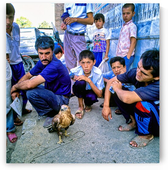 Street vendors and kids gather around a hawker in Uzbekistan by Marco Brivio