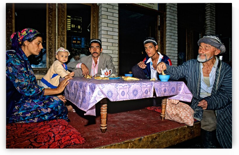 Family enjoys traditional dinner in Samarkand Uzbekistan by Marco Brivio