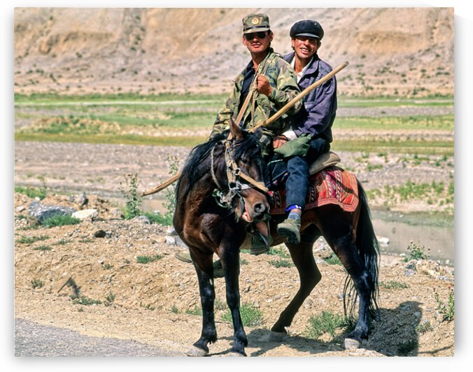 Tadjik men ride a horse in Uzbekistans landscape by Marco Brivio
