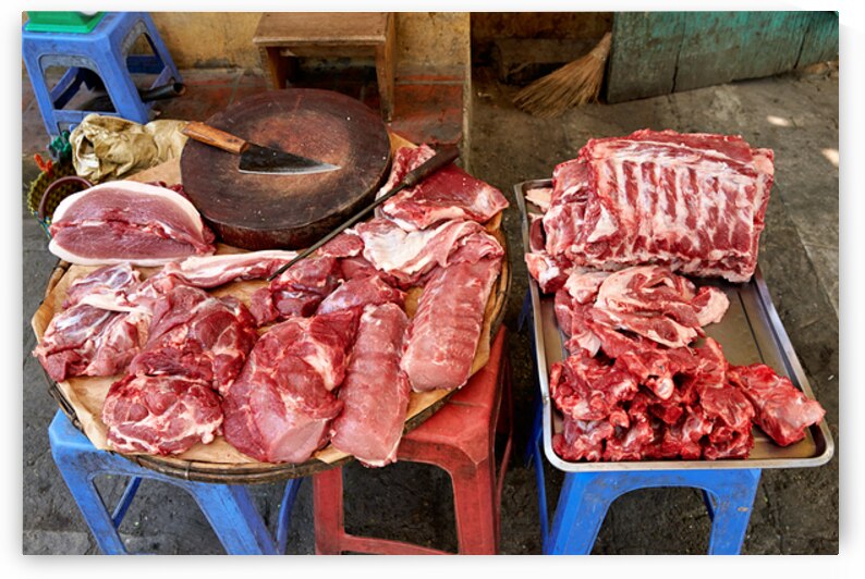 Fresh meat sold in Hanoi market during daytime by Marco Brivio