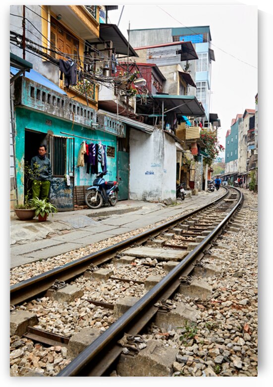 Locals near train tracks in Ho Chi Minh City Vietnam by Marco Brivio
