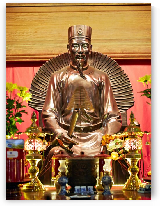 Statue of a historic figure in Hanoi Vietnam during the day by Marco Brivio
