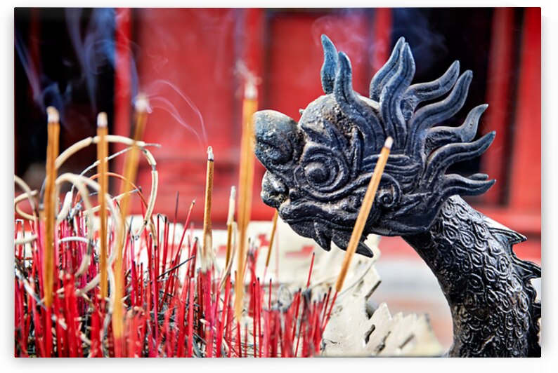 Incense and dragon decor in Hanoi Vietnam during prayer time by Marco Brivio