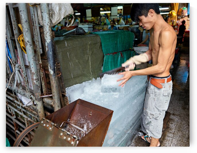 Ice cutting at a market in Ho Chi Minh City Vietnam by Marco Brivio