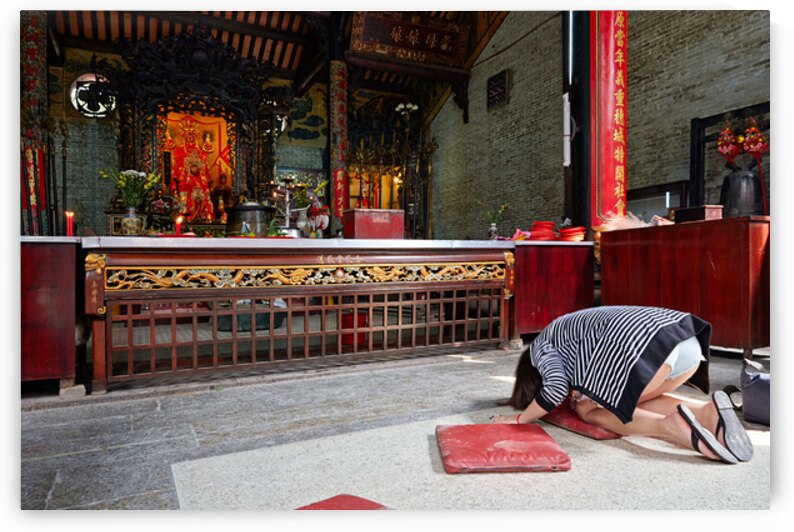 Worshippers at a temple in Ho Chi Minh Vietnam by Marco Brivio