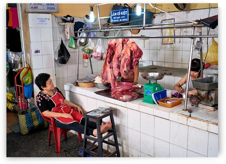 Market scene in Ho Chi Minh City with meat vendor and customer by Marco Brivio