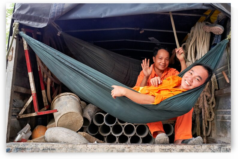 Workers relax in a truck in Ho Chi Minh City Vietnam by Marco Brivio