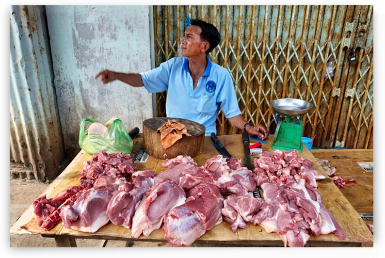 Local butcher selling meat in Phu Quoc market area by Marco Brivio