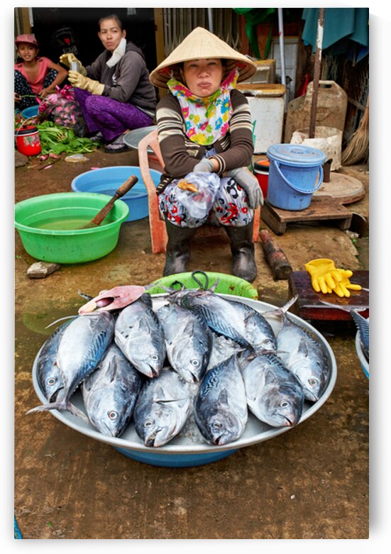 Fishing woman at market in Phu Quoc Vietnam during the day by Marco Brivio