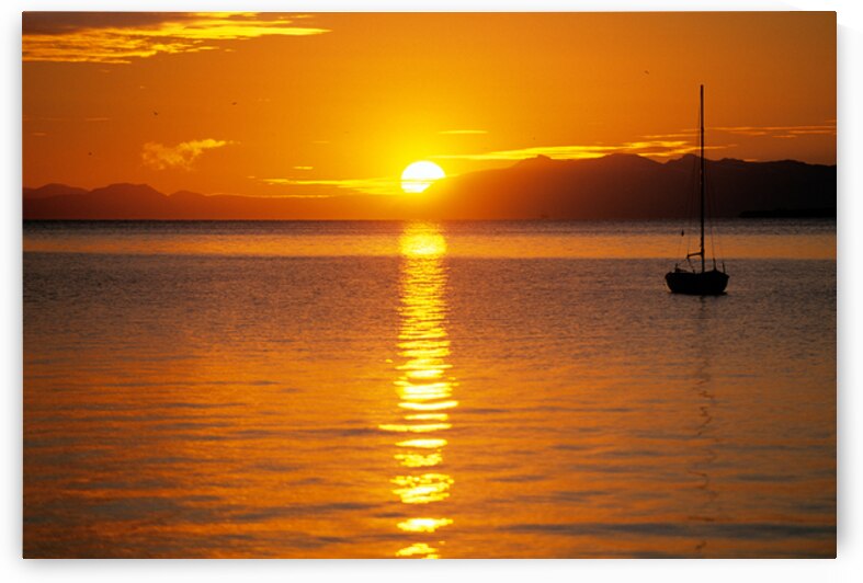 Midnight sun at Longyearbyen in Svalbard with a boat on the water by Marco Brivio