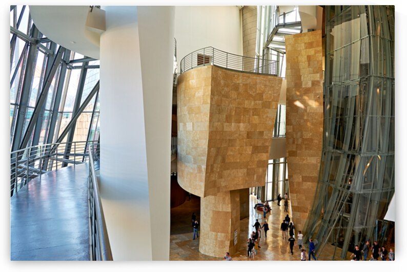 Inside Guggenheim Museum in Bilbao Spain with visitors walking by Marco Brivio