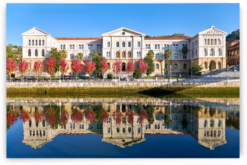 University building reflects in water in Bilbao Spain by Marco Brivio
