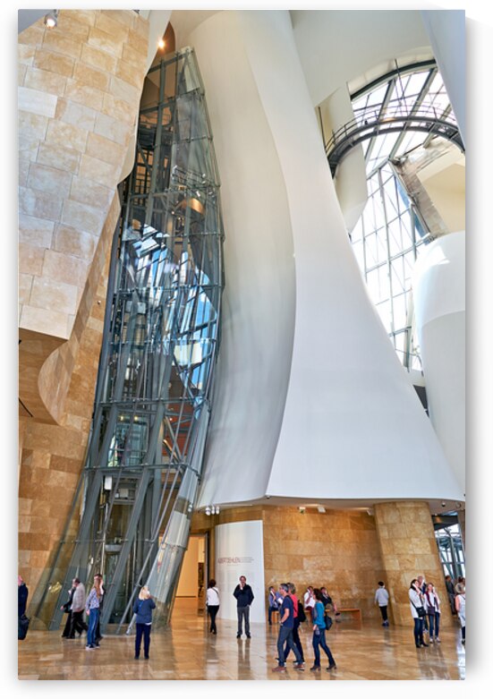 Visitors explore the interior of the Guggenheim Museum in Bilbao by Marco Brivio