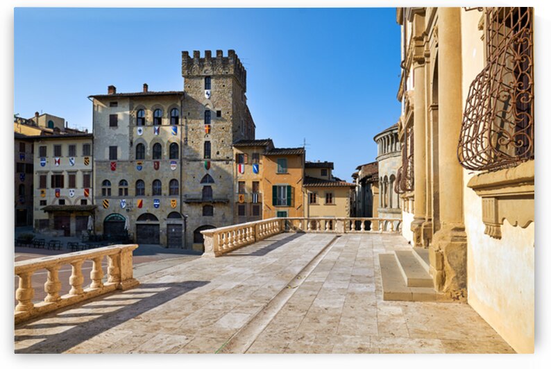 People walk through Piazza Grande in Arezzo Italy by Marco Brivio