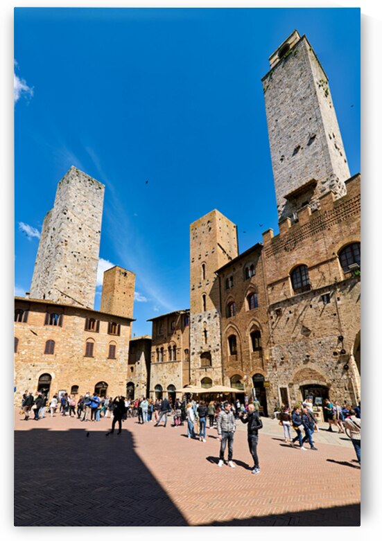 Visitors gather in Piazza del Duomo in San Gimignano Italy by Marco Brivio