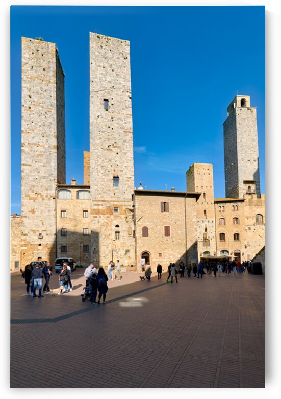 Tourists explore the towers in Piazza del Duomo in San Gimignano by Marco Brivio