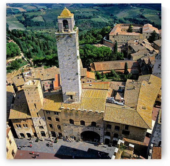 View of San Gimignano in Tuscany from above during the day by Marco Brivio