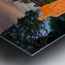 Monk stands by pond with Angkor Wat and sunset sky. Metal print