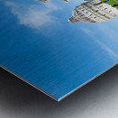 People walk in Piazza dei Miracoli admiring the Baptistry and Cathedral in Pisa. The sun shines on the historic buildings and green grass. Metal print