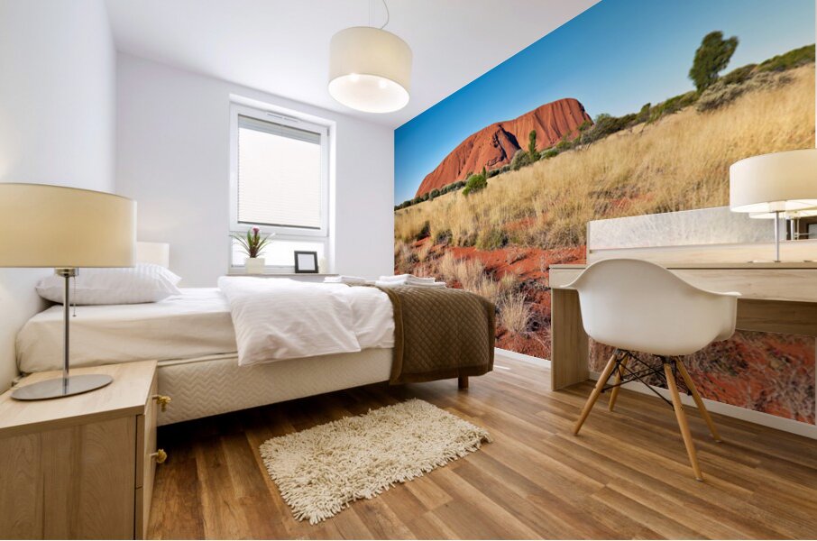 Uluru Australias iconic sandstone monolith under a clear blue Mural print