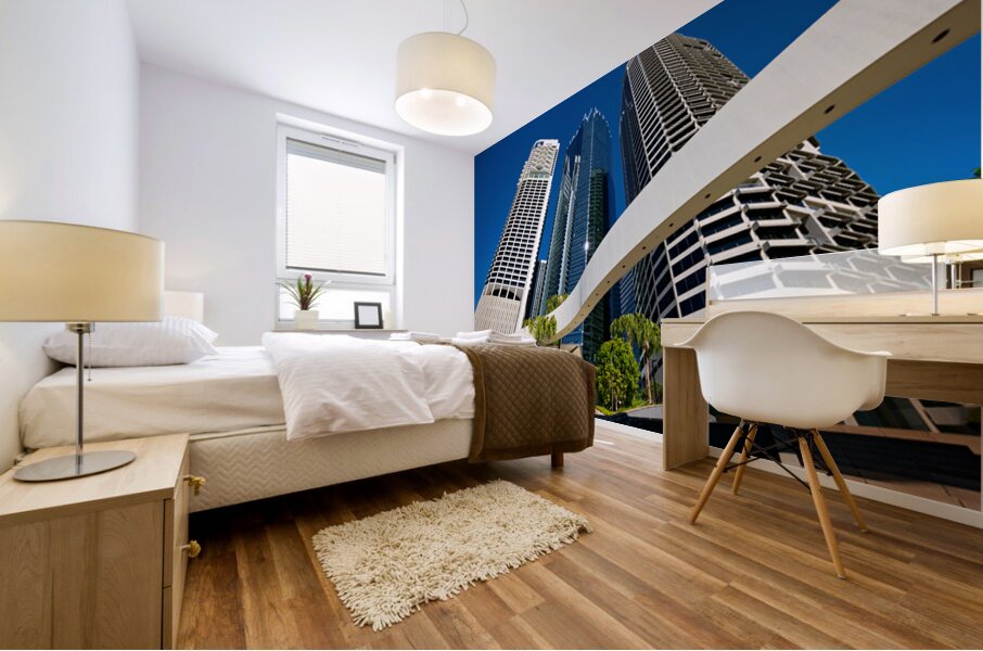 Woman walks on stairs in modern urban area with tall buildings Mural print