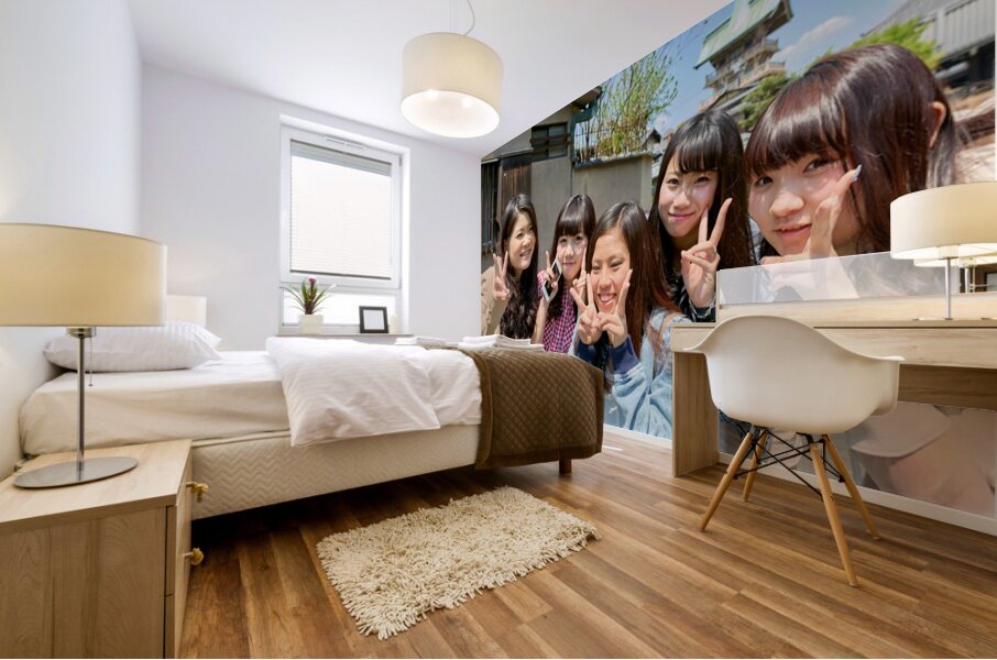 Young girls smiling in Kyoto while enjoying the day together Mural print