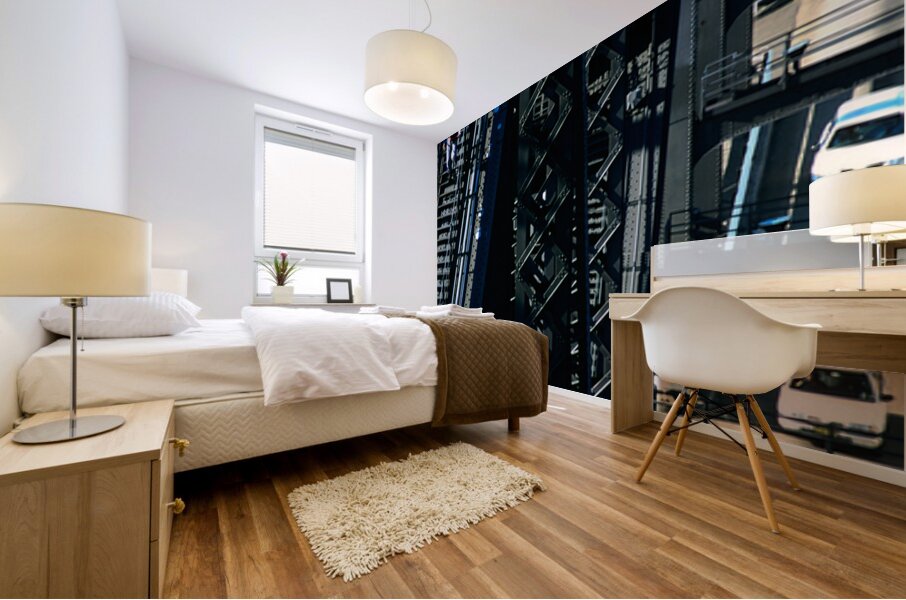 Man walks on bridge with cars below Mural print