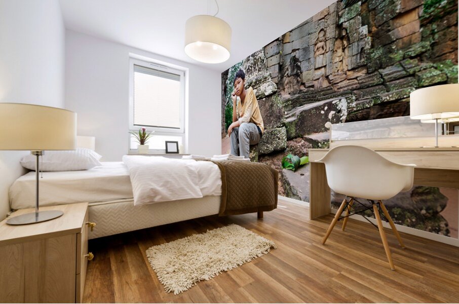 Young person sits on ancient temple ruins. Mural print