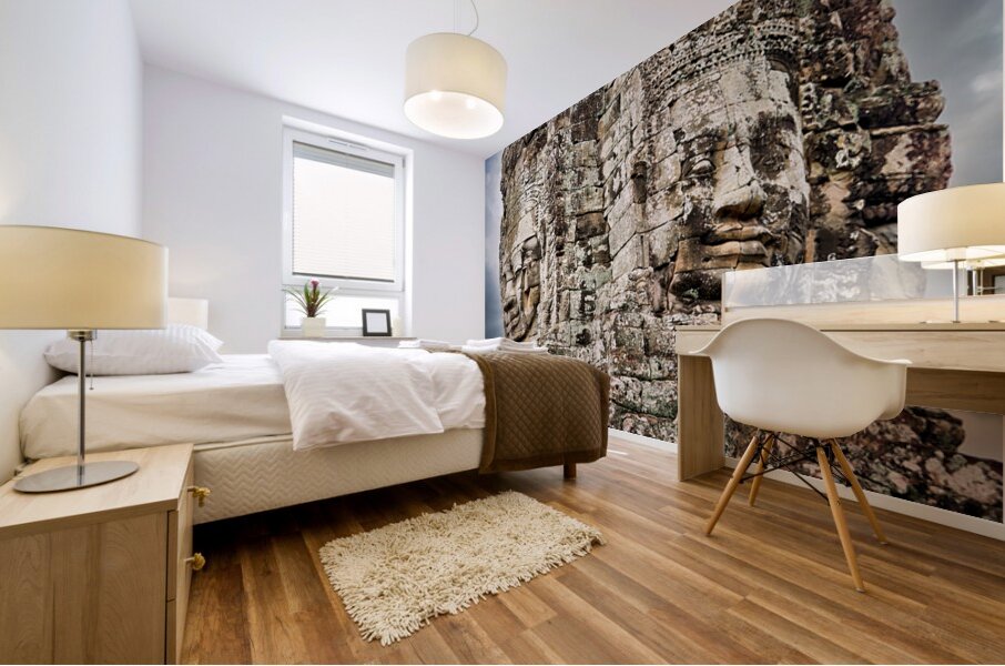 Ancient stone faces carved into Bayon Temple Cambodia. Mural print