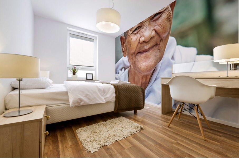 Smiling elderly Asian woman in white robe. Mural print