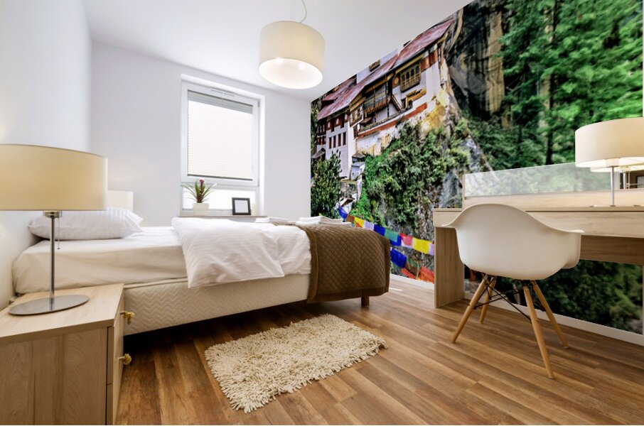 Iconic Bhutanese monastery on a cliff surrounded by prayer flag Mural print