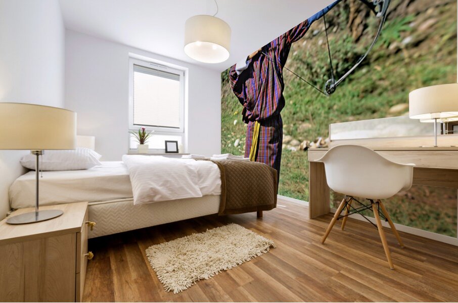 Bhutanese archer in traditional Gho aiming a compound bow. Mural print