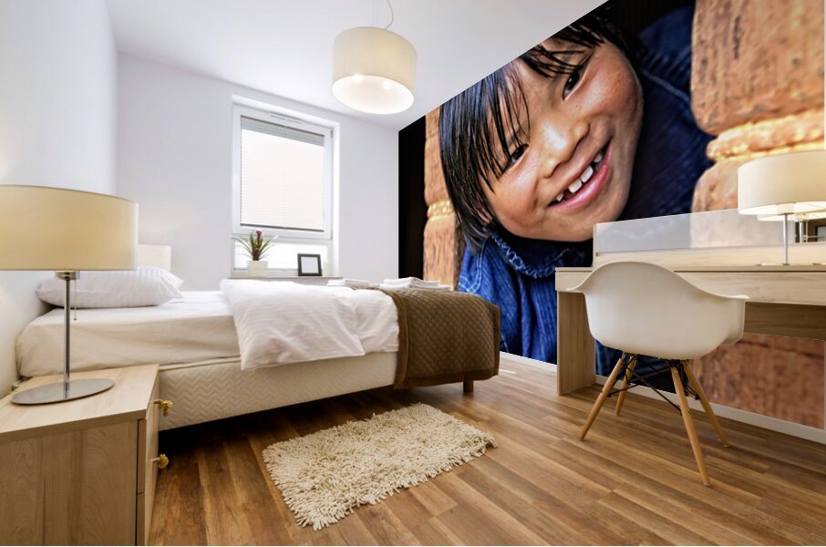 Smiling child peeking from a wooden window. Mural print