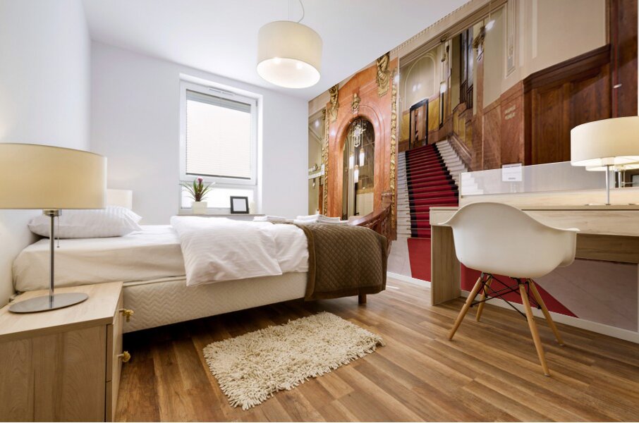 Elegant interior with red carpeted staircase and ornate gold det Mural print