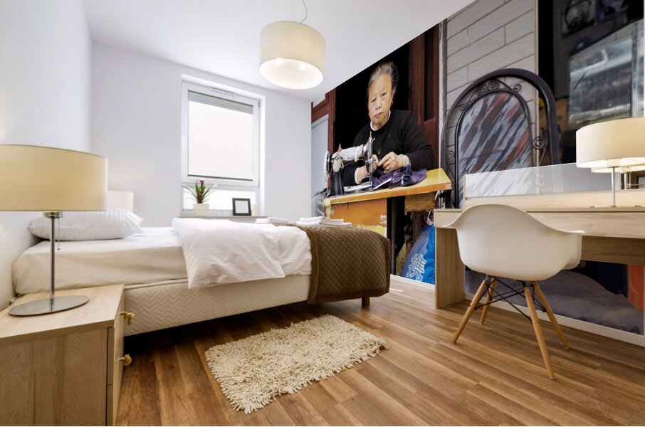 Elderly woman sews at machine in Shanghai China Mural print