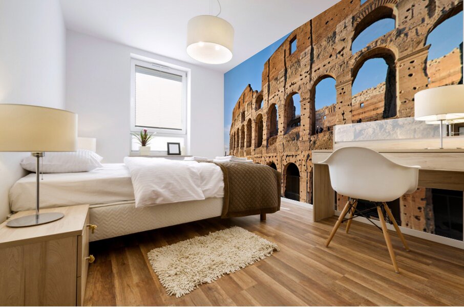 Colosseum stands tall in Rome during golden hour Mural print