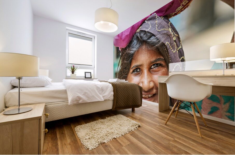 Portrait of a young girl carrying cloth in Mandawa Rajasthan Mural print