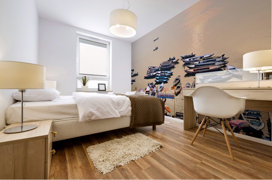 Sunrise at Ganges River in Varanasi with boats and activities Mural print