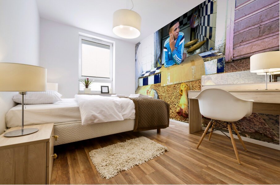 Butcher in Meknes souk interacts with customers during market ho Mural print