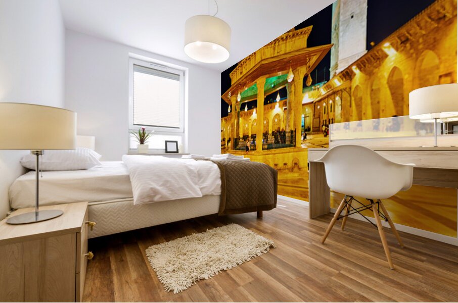 Aleppo mosque at night with lights and visitors in the courtyard Mural print