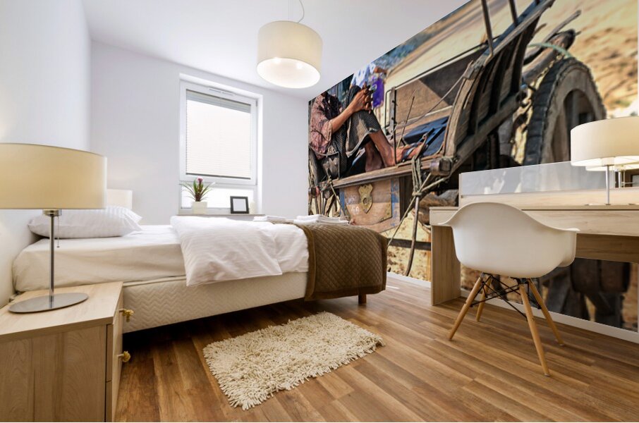 Man rests on cart in Myanmar during warm daytime Mural print