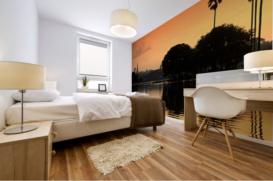 Sunset over the water in Yangon with palm trees and buildings Mural print