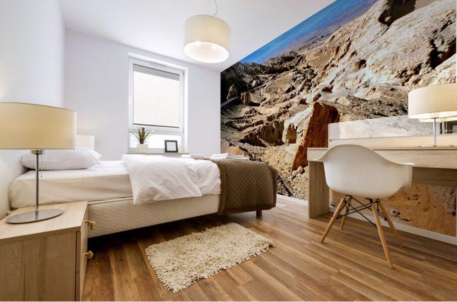 Dramatic arid mountain landscape with a winding road. Mural print