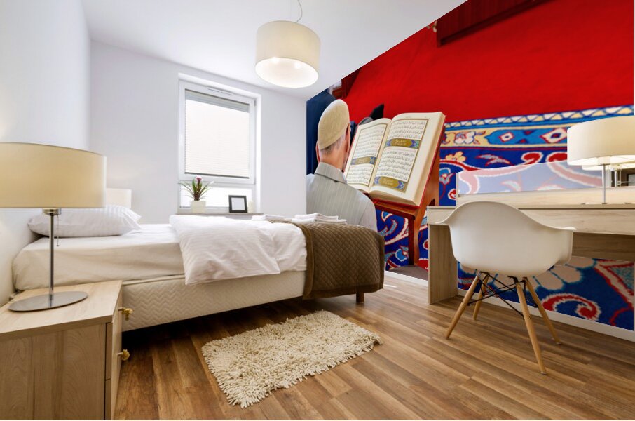 Man reading Quran inside Fatih Mosque in Istanbul Turkey Mural print