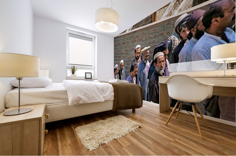 Men heading to work in Peshawar streets during morning hours Mural print