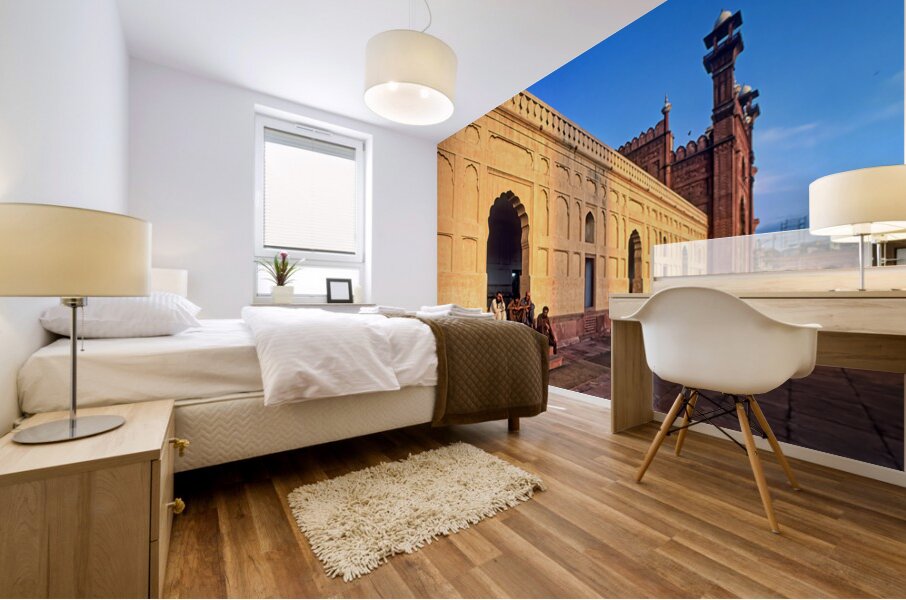 Visitors rest by Badshahi Mosque during sunset in Lahore Mural print