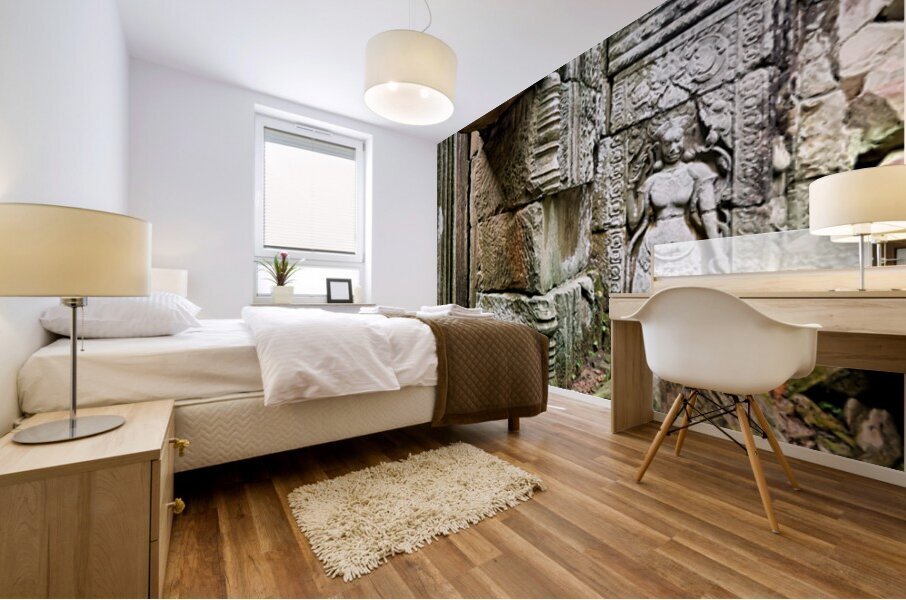 Ancient temple ruins with carved stone deity and moss. Mural print