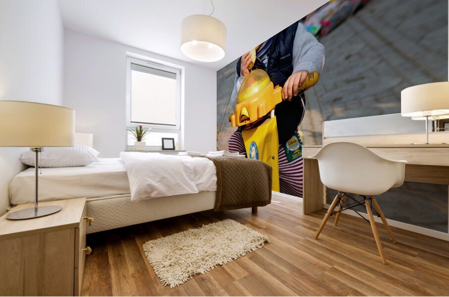 Child enjoys snack while riding tricycle in Hanoi streets Mural print